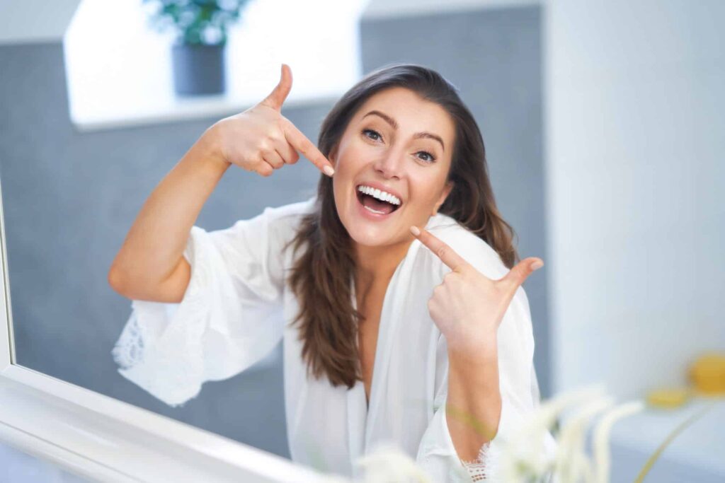 young nice brunette woman in the bathroom
