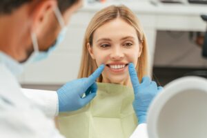 Patient having a consultation with her dentist about the benefits of a Smile Makeover vs. Full-Mouth Restoration