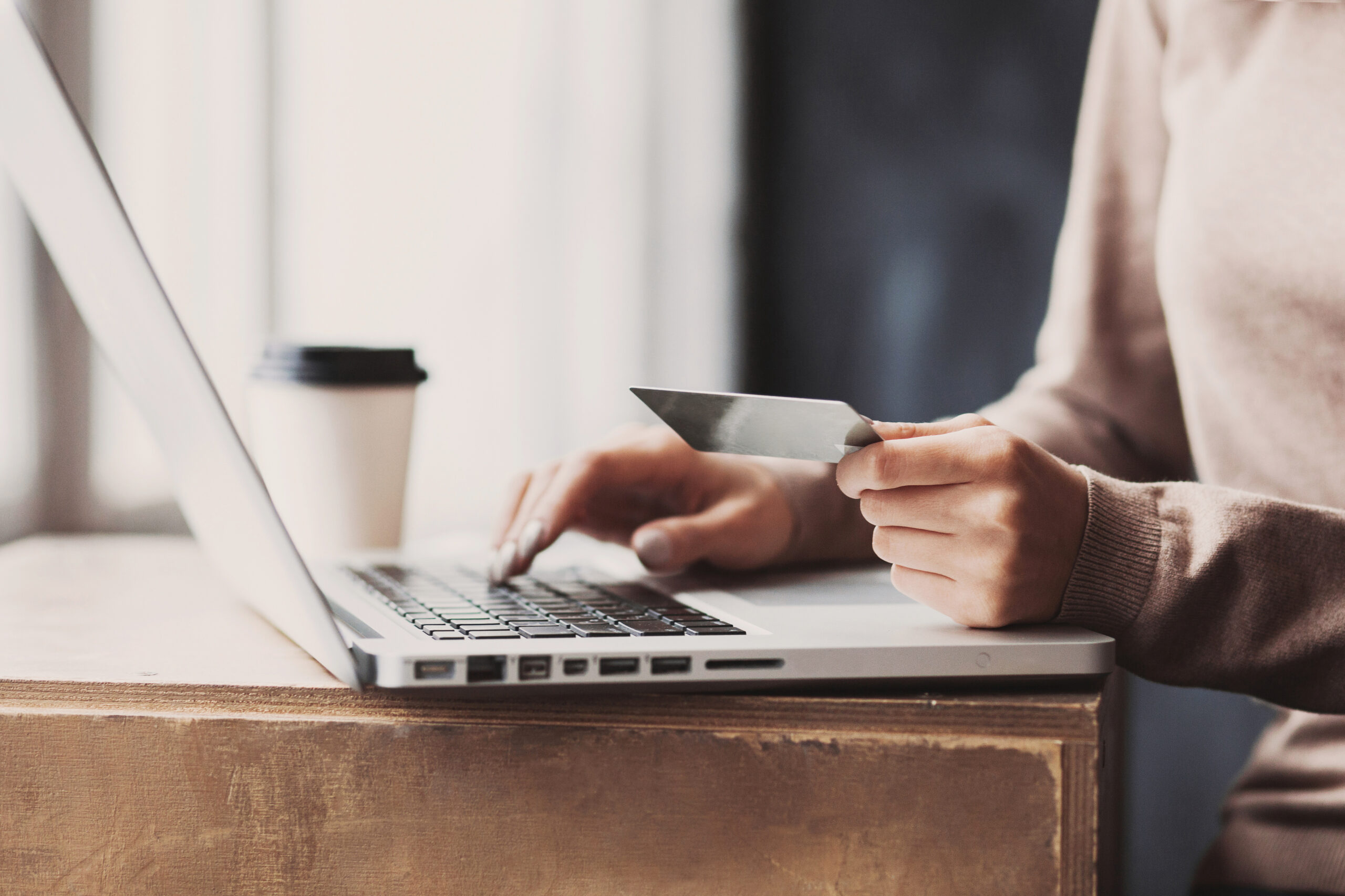 Patient applying online for dental financing on a laptop
